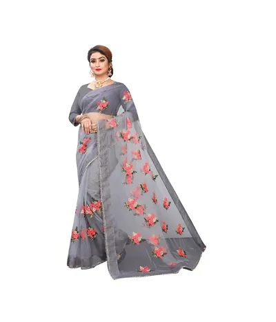 Beautiful fancy Stylist net fabric embroidery Saree With classy silk Blouse Piece