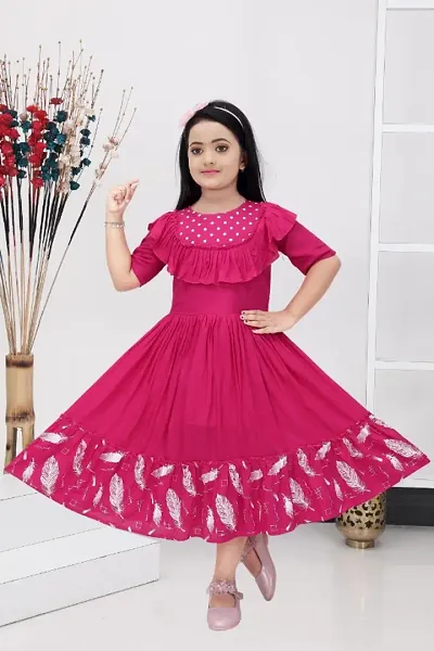 Fashionable and uniquely designed Polka and Feather Color frock for girls.