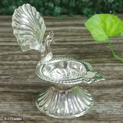 GODS CHOICE German Silver Beautiful Peacock With Feather Designing Diya For Pooja / Decor Size : 4 Inches Weight : 50 Grams-thumb0