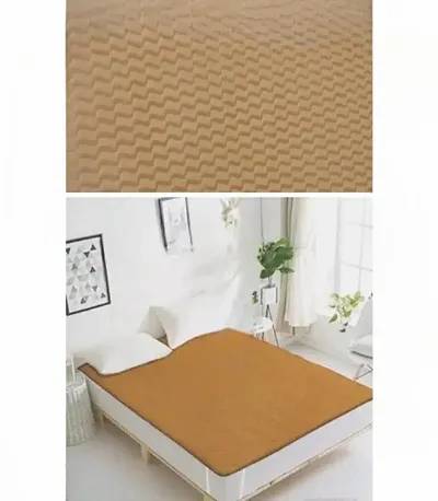 baby care waterproof mattress protector sheet of beige colour with zig zag pattern of heavy quality also 100PERCENT waterproof