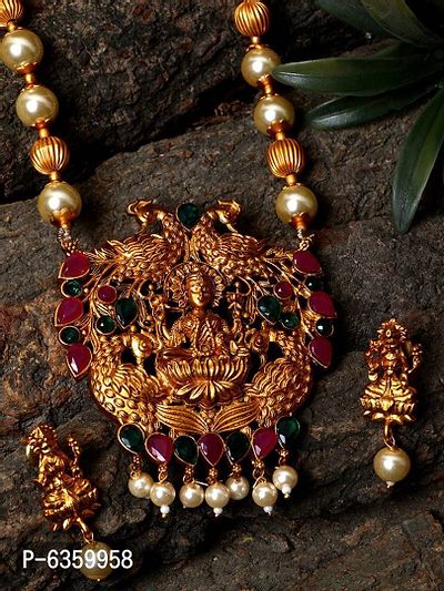 Antique Matte Gold Finish Goddess Laxmi Green Stone Studded Temple Jewellery set