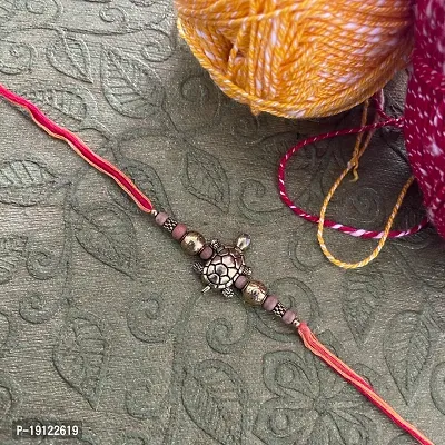 Fancy Rakhi Designs Tortoise With Brown Beads Multicoloured Mauli Raksha Bandhan