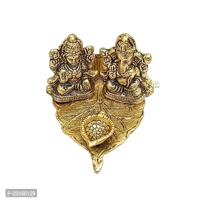 Haridwar divine lakshmi ganesh gold plated statue with diya on leaf